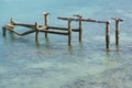 Old harbor ruins in the blue sea