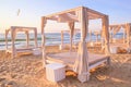 Coastal landscape - view of the sandy seashore with beach gazebos Royalty Free Stock Photo