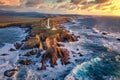 Coastal lighthouse during the red sunset Royalty Free Stock Photo