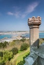 Coastal location around st michaels mount in cornwall england uk. Lookout post in Marizion harbour. White castlated building next Royalty Free Stock Photo