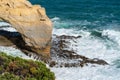 Coastal natural arch viewed from adjacent cliffs Royalty Free Stock Photo