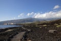 Coastal path crossing the volcanic malpais nearby Puertito de Guimar town, Tenerife, Canary Islands, Spain Royalty Free Stock Photo