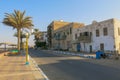 Coastal promenade in the ancient city of Quseir in Egypt. Landmark in photo is a historic building built of sea corals. Old Road. Royalty Free Stock Photo