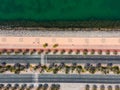 Coastal road with palm trees and running track in Marjan Island in Ras al Khaimah emirate of UAE