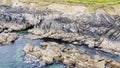 Coastal rocks under sea water, seascape. The coastline of the Atlantic Ocean, the north of Europe. Beautiful ocean water, top view Royalty Free Stock Photo