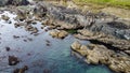 Coastal rocks under sea water, seascape. The coastline of the Atlantic Ocean, the north of Europe. Beautiful ocean water, top view Royalty Free Stock Photo