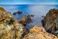 Coastal rocky landscape with a girl looking into the distance