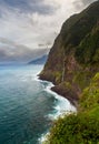 Majestic coastal scenery from veu-de-noiva viewpoint for old coastal road with waterfall and steep cliffs in Madeira