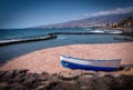 Coastal seascape with boat in foreground at Las Americas Tenerife