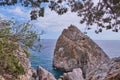 Rock Diva, the black sea coast near Yalta, town Simeiz, Crimea. People walk on the suspension bridge, climb to the top. Royalty Free Stock Photo