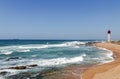 Coastal Seascape with Red and White Lighthouse Blue Sky Royalty Free Stock Photo