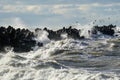 Coastal storm in the Baltic Sea, big waves crash against the harbor breakwater, breaking wave Royalty Free Stock Photo