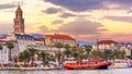 Coastal summer cityscape - view of the promenade the Old Town of Split with the Palace of Diocletian and bell tower of the Cathedr