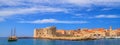 Coastal summer landscape, banner - view of a sailboat and the City Harbour of the Old Town of Dubrovnik