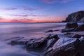 Coastal sunset on rocky beach in Cornwall, England Royalty Free Stock Photo