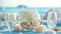 Beach Wedding Table Setting with Seashells, Candles and Champagne Glasses Royalty Free Stock Photo