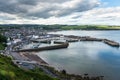 Coastal town with a harbour and cloudy sky Royalty Free Stock Photo