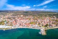 Coastal town of Posedarje waterfront and Velebit mountain aerial view