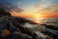 Coastal tranquility Sunset paints the rocky shore of a tropical beach Royalty Free Stock Photo