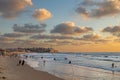 Coastal view of the ancient city of Yafo or Jaffanear Tel Aviv, Israel. Cityscape in sunset hour with clouds in the sky Royalty Free Stock Photo