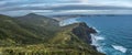 Coastal view with steep green rocky cliffs