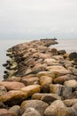 Coastal Vigil: Stone Jetty Route Leading to the Beacon Overlooking the Boundless Sea