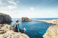 Coastal walker relax on rocky seaside Royalty Free Stock Photo