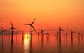 Coastal wind turbines sunset