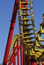 coaster track detail in bright yellow and red with blue sky