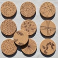 Coasters made of cork are displayed featuring intricate geometric Royalty Free Stock Photo