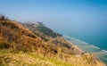 Coastline along the mount San Bartolo, near Pesaro; the village Fiorenzuola di Focara in the background