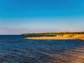 The coastline along the water horizon of the Dnieper River.