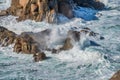 Coastline around Lands End in Cornwall England on a windy day and rough seas