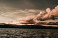 Coastline with cloudy sunset sky, Southern of Thailand sea and mountains on background. Royalty Free Stock Photo