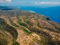 Coastline with hills and blue ocean in Nusa Penida. Aerial view of tropical island Royalty Free Stock Photo