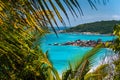 Coastline of La Digue island in Seychelles. Grand and Petite Anse paradise beaches with blue ocean lagoon between green