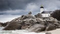 Coastline landscape in low tide with lighthouse and peculiar rocks in Brittany, France Royalty Free Stock Photo