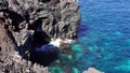 Coastline of lava rocks with crystal clear water in Azores Island, Portugal Royalty Free Stock Photo