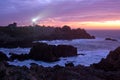 Coastline and lighthouse at dusk Royalty Free Stock Photo