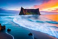 The coastline near Vik rocks is at sunset.