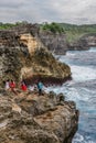 Coastline on Nusa Penida island near Angel`s Billabong beach with tourists