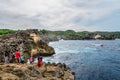 Coastline on Nusa Penida island near Angel`s Billabong beach with tourists