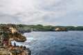 Coastline on Nusa Penida island near Angel`s Billabong beach with tourists