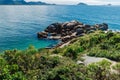 Coastline with plants, amazing rocks and turquoise quiet ocean