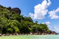 Coastline of Praslin Island, Seychelles, with large granite rock formations, Cote d`Or Beach in Anse Volbert