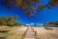 Coastline promenade with pine trees and tourquise clear water at Porto Cervo, Costa Smeralda, Sardinia, Italy Royalty Free Stock Photo