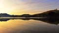 Coastline & reflections along Otago Peninsula lake Royalty Free Stock Photo