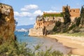 Coastline with sandy beach and castle in Ferragudo, Algarve, Portugal Royalty Free Stock Photo