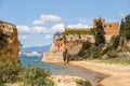 Coastline with sandy beach and castle in Ferragudo, Algarve, Portugal Royalty Free Stock Photo