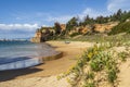 Coastline with sandy beach, flowers and castle in Ferragudo, Algarve, Portugal Royalty Free Stock Photo